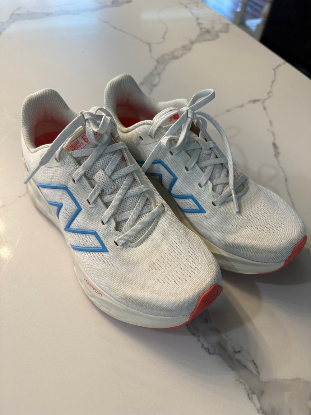 New Balance 680 White Sneakers with Blue Logo and Coral Accents